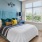 a bedroom with a bed and lamps
