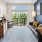 a living room with a couch and a mirror