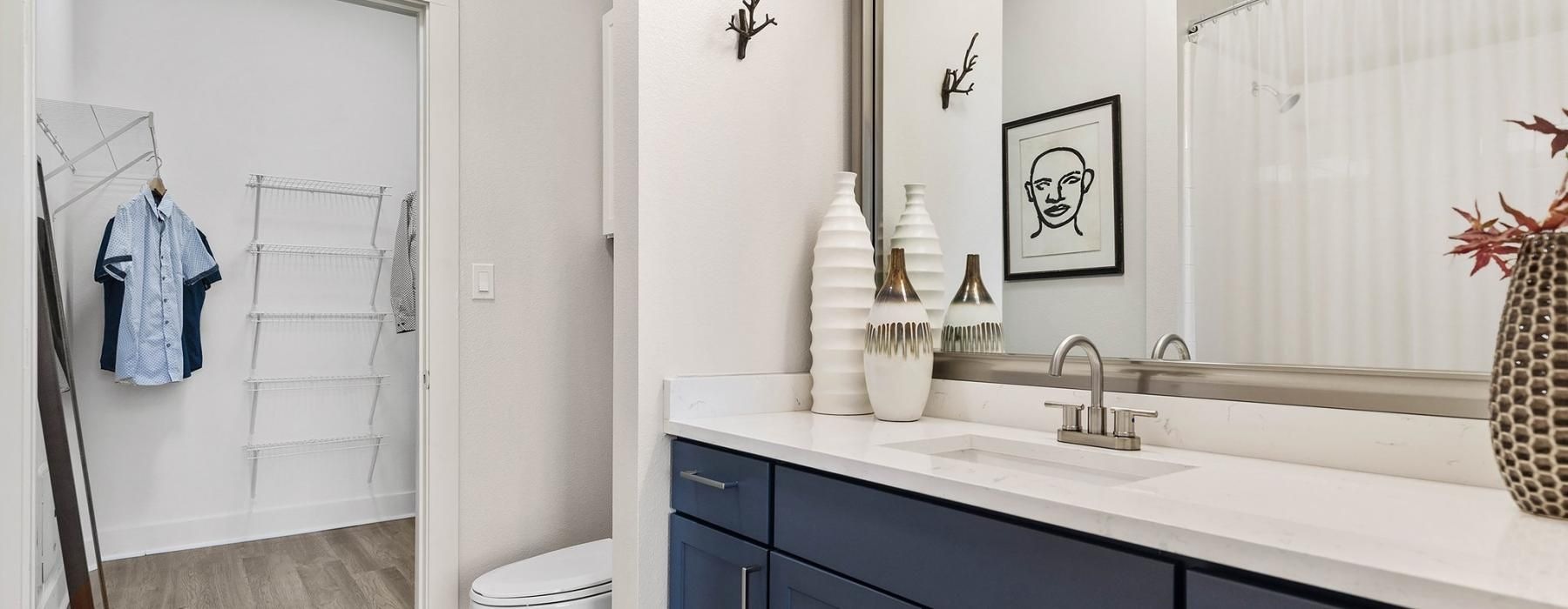 a bathroom with a sink toilet and mirror