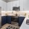 a kitchen with white cabinets