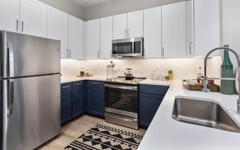a kitchen with white cabinets