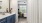 a bathroom with a sink and a bed