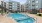 a swimming pool in a courtyard between buildings