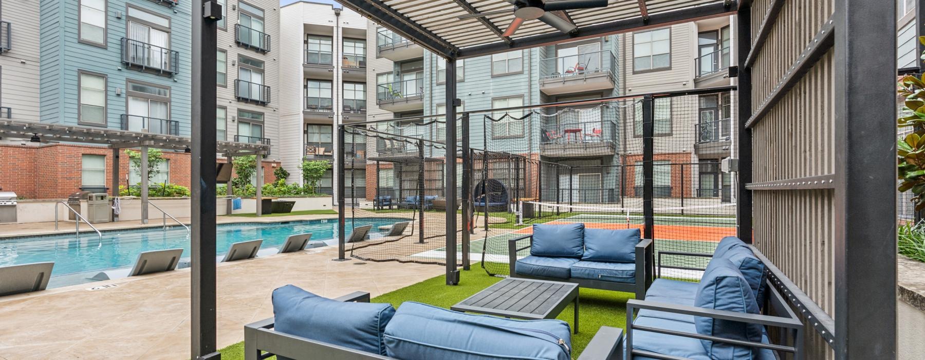 a deck with a pool and chairs