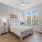 Large open bedroom with natural light and windows