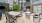 a table and chairs outside a building